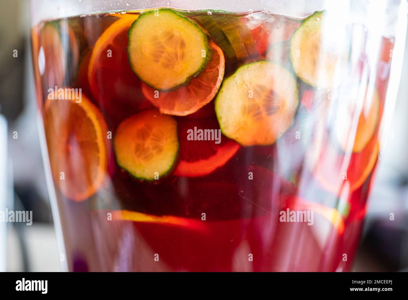 fruit punch in a drink dispenser at a party Stock Photo - Alamy