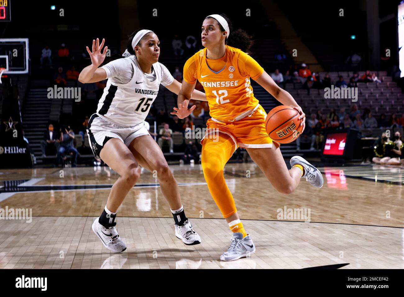 Tennessee guard Rae Burrell (12) drives against Vanderbilt forward ...