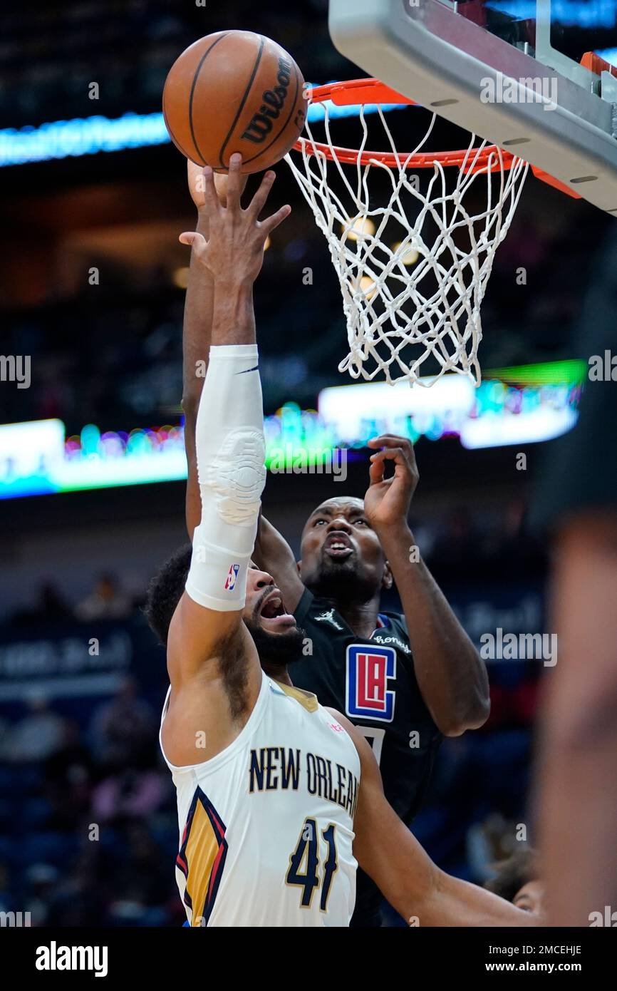 New Orleans Pelicans forward Garrett Temple (41) goes to the basket against  Los Angeles Clippers center Serge Ibaka in the first half of an NBA  basketball game in New Orleans, Thursday, Jan.