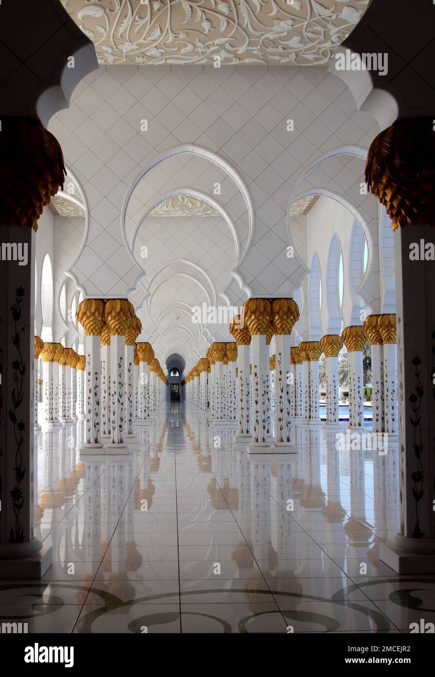 A vertical shot of a white corridor with columns, Sheikh Zayed Grand ...