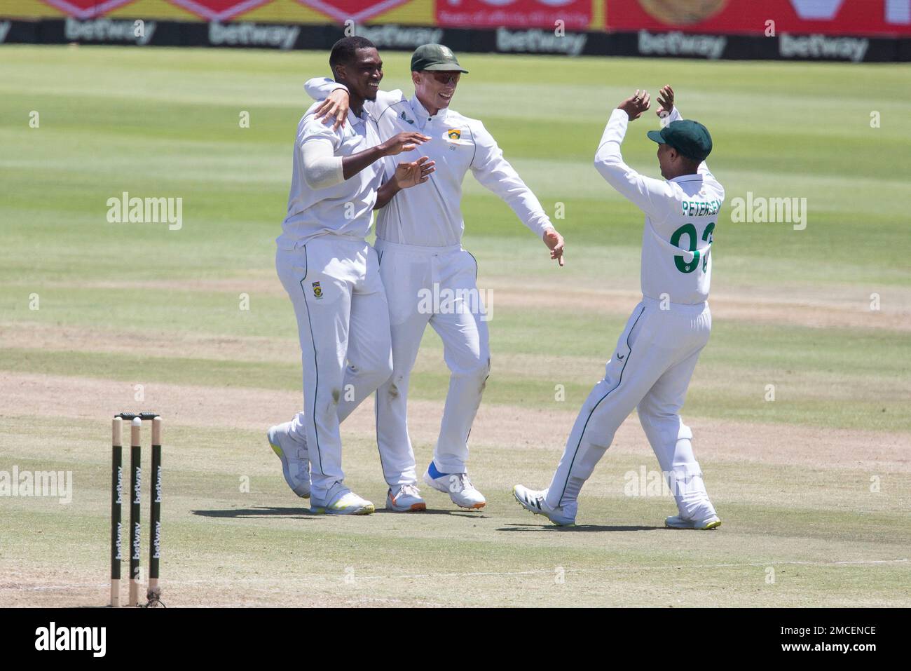 South African bowler Lungi Ngidi, left, celebrates the wicket of Virat Kohl  with team mates Rassie van Der Dussen and Keegan Peterson during the third  day of the third and final test