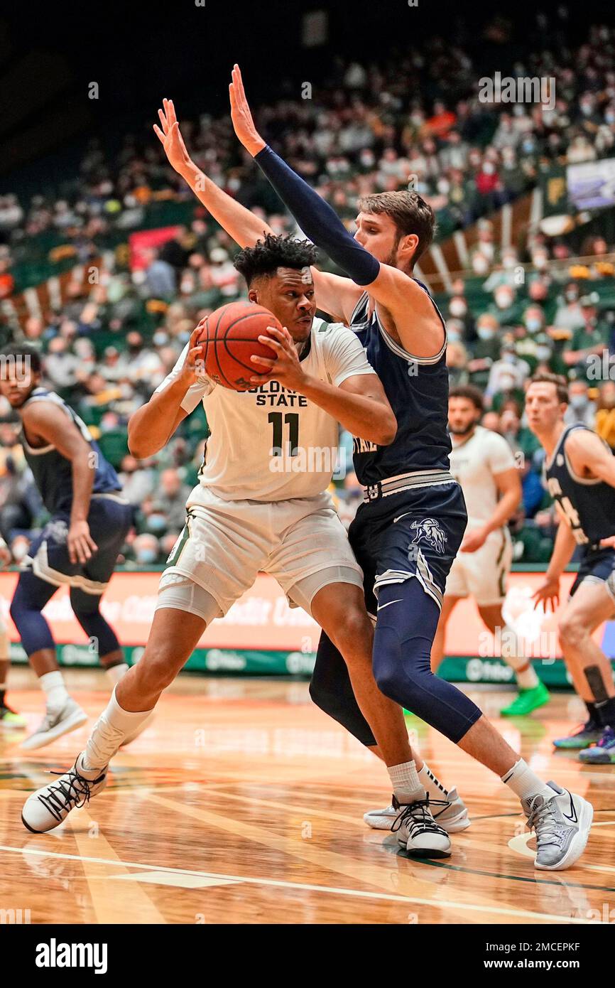 Colorado State forward Dischon Thomas (11) is pressured by Utah State