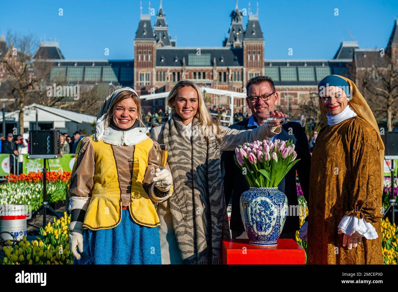 Olympic skating champion, Irene Schouten (middle left), President of the organization 'Tulpen promotie Nederland', Arjan Smit (middle right) are seen posing for the media. Each year on the 3rd Saturday of January, the National Tulip Day is celebrated in Amsterdam. Dutch tulip growers built a huge picking garden with more than 200,000 colorful tulips at the Museumplein in Amsterdam. Visitors are allowed to pick tulips for free. The event was opened by Olympic skating champion, Irene Schouten. Prior to the opening, she christened a new tulip: Tulipa 'Dutch Pearl' as a reference to the world - fa Stock Photo