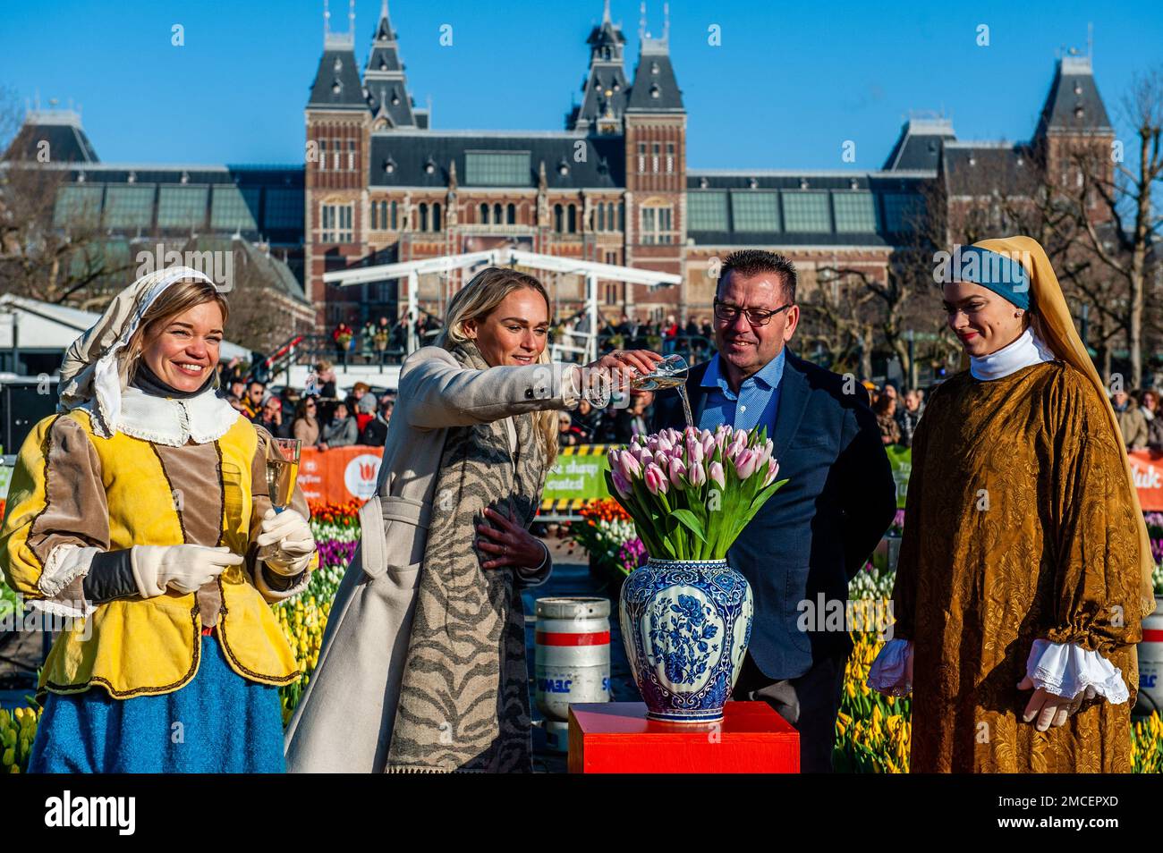 Olympic skating champion, Irene Schouten (middle) seen christening a new tulip: Tulipa 'Dutch Pearl'. Each year on the 3rd Saturday of January, the National Tulip Day is celebrated in Amsterdam. Dutch tulip growers built a huge picking garden with more than 200,000 colorful tulips at the Museumplein in Amsterdam. Visitors are allowed to pick tulips for free. The event was opened by Olympic skating champion, Irene Schouten. Prior to the opening, she christened a new tulip: Tulipa 'Dutch Pearl' as a reference to the world - famous painting 'The girl with a pearl earring' by Johannes Vermeer. Stock Photo