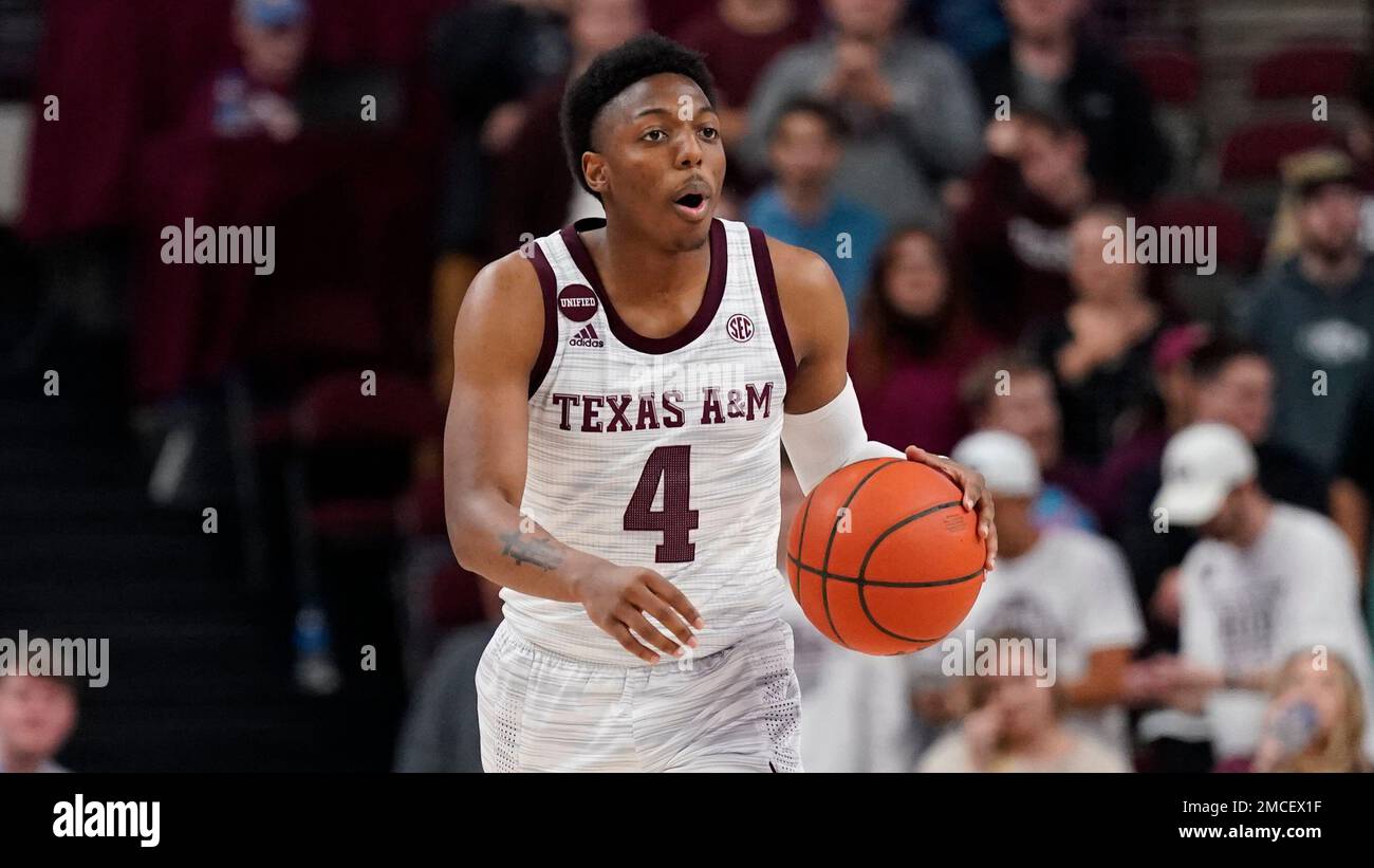 Texas A&M guard Wade Taylor IV (4) brings the ball down court again ...
