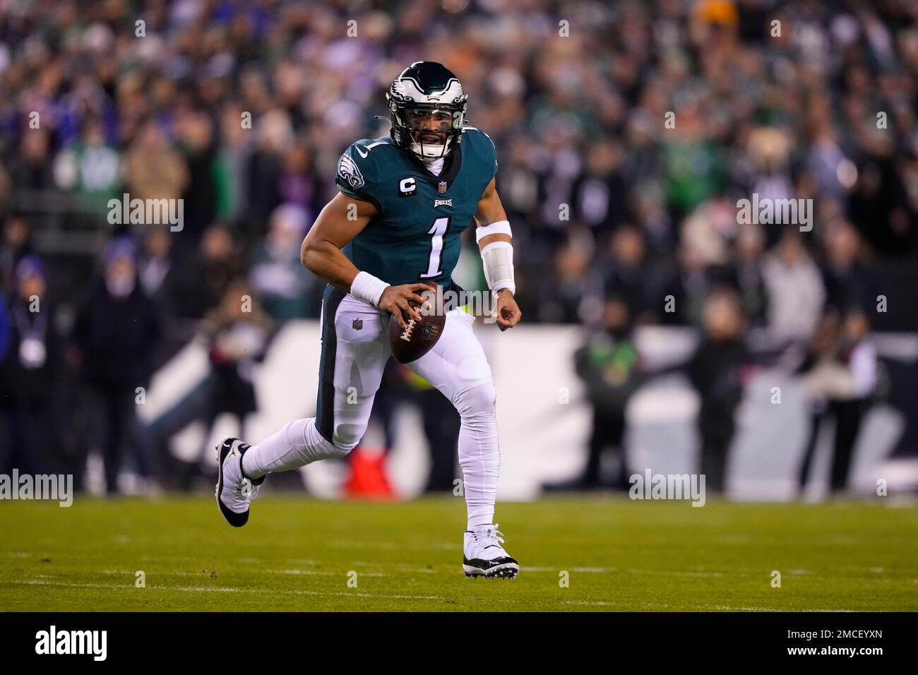 Philadelphia Eagles quarterback Jalen Hurts scrambles for yardage