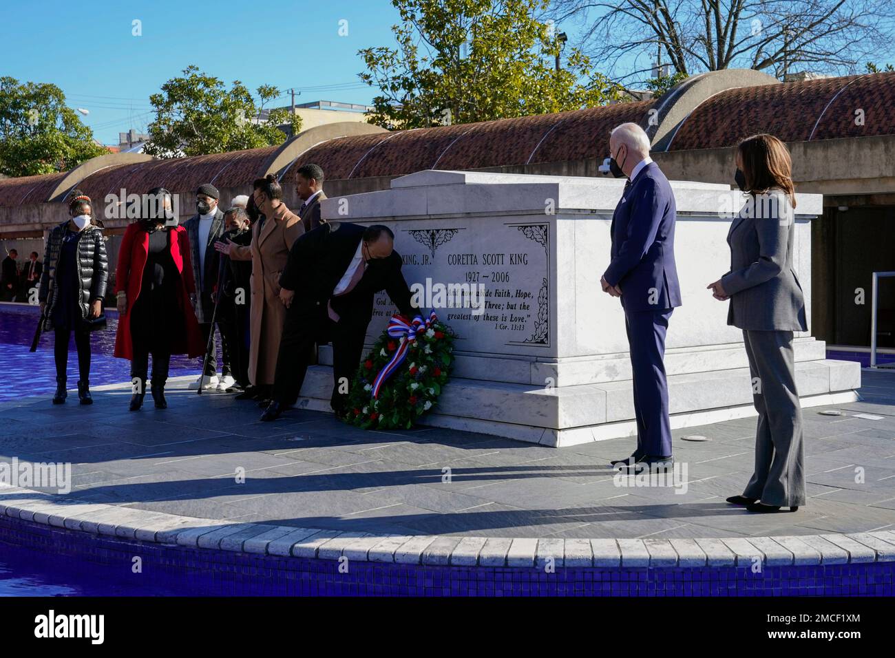President Joe Biden and Vice President Kamala Harris look on as Martin