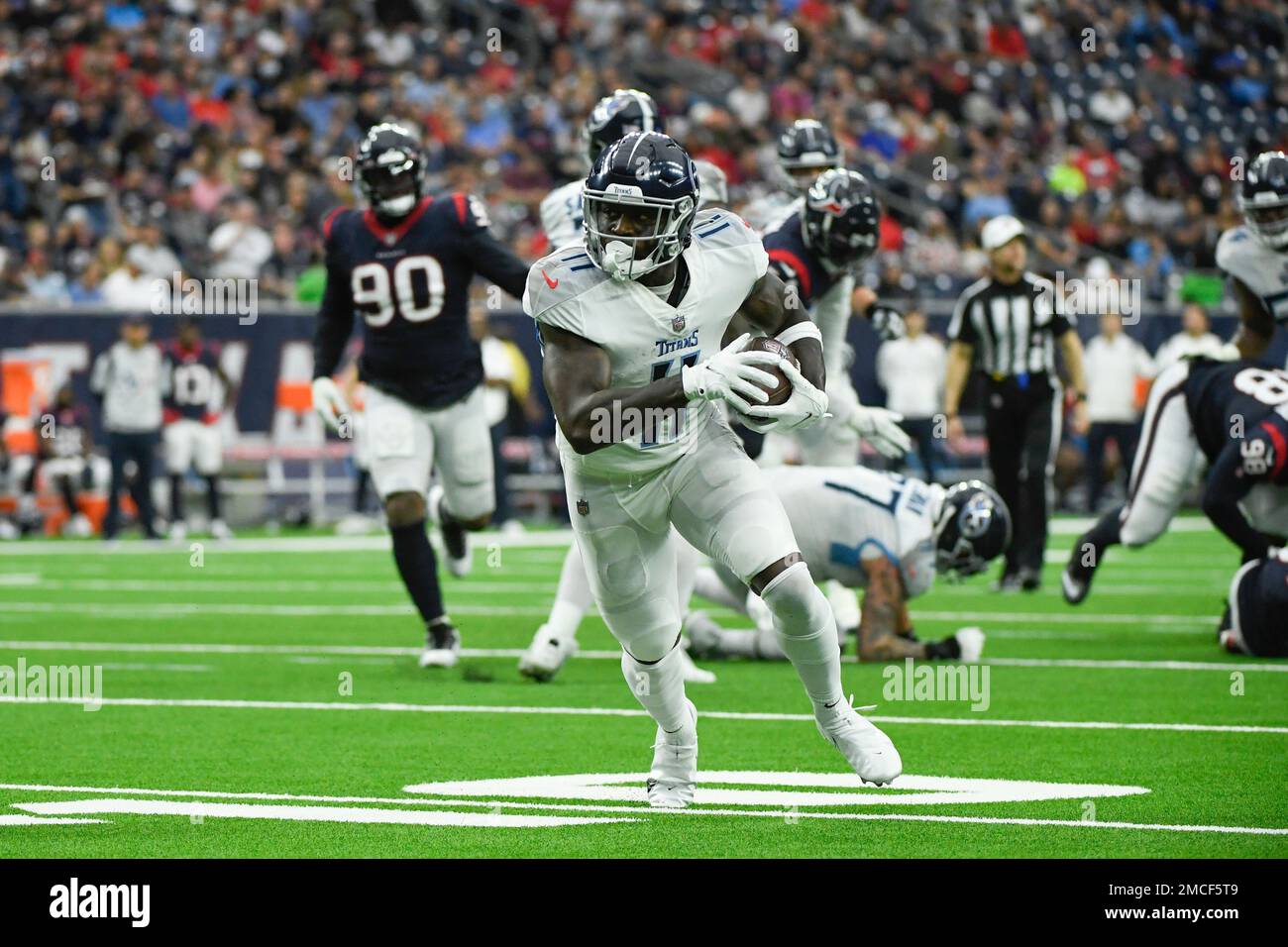 Tennessee Titans wide receiver A.J. Brown (11) runs the ball in for a  touchdown against the Houston Texans during the first half of an NFL  football game Sunday, Jan. 9, 2022, in