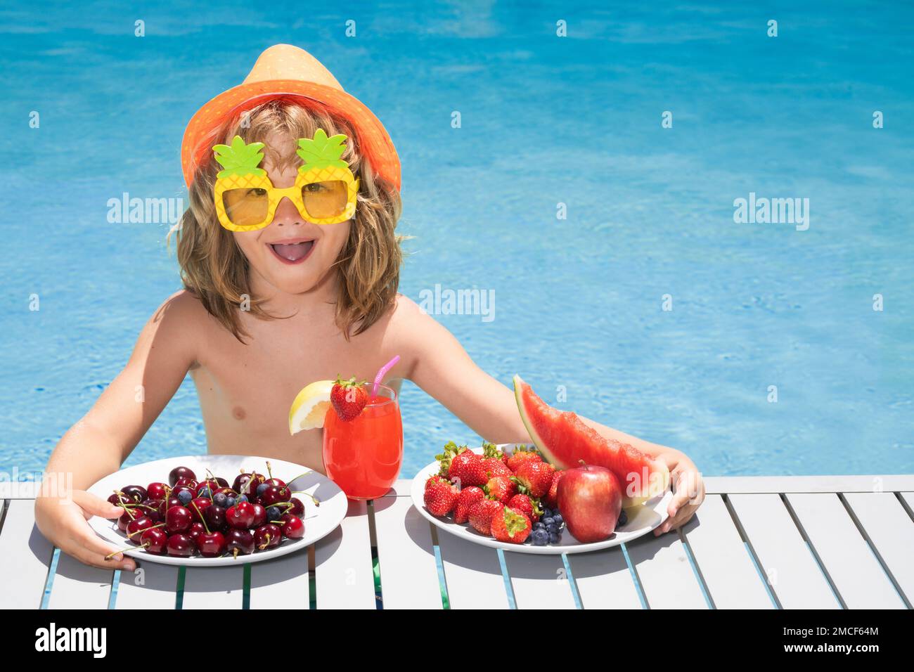 Child in swimming pool. Kids swim on summer vacation. Beach sea and