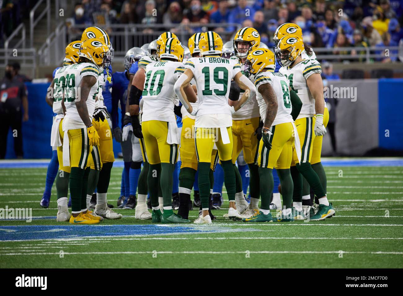 Green Bay Packers huddle up on offense against the Detroit Lions