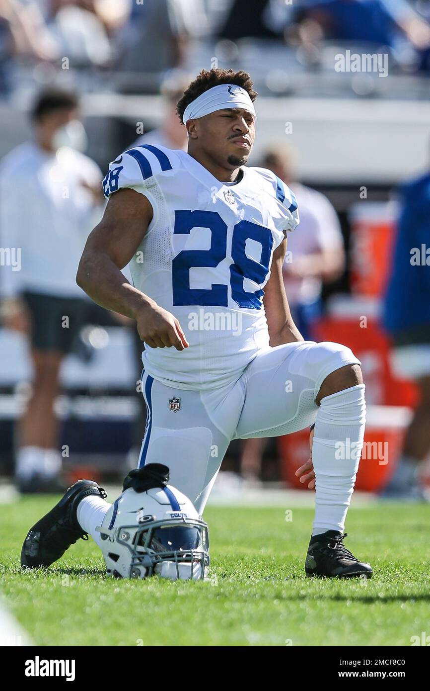 Indianapolis Colts running back Jonathan Taylor (28) stretches during  warm-ups before of an NFL football game against the Jacksonville Jaguars,  Sunday, Jan. 9, 2022, in Jacksonville, Fla. The Jaguars defeated the Colts