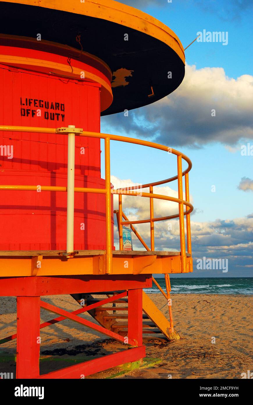 A funky and colorful lifeguard station, temporarily closed, stands along Miami Beach, awaiting the next day of beach goers on summer vacation Stock Photo