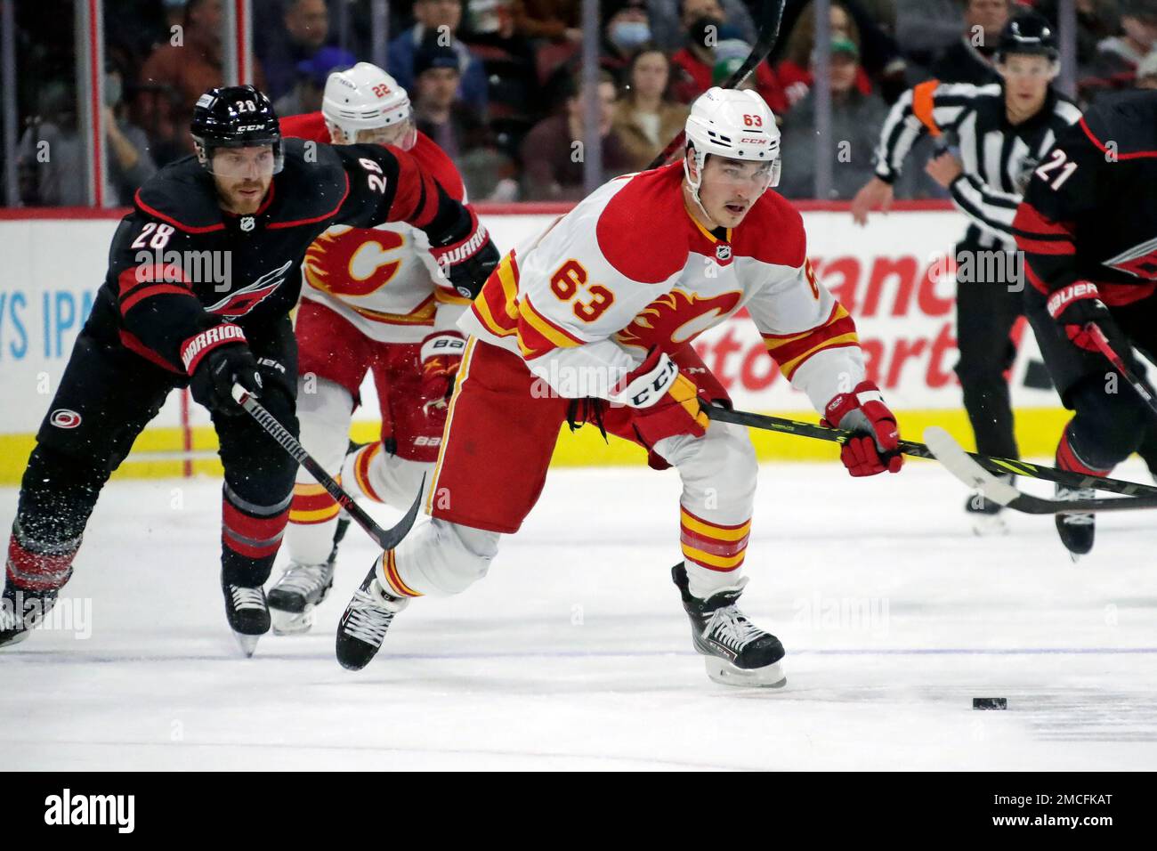 Calgary Flames center Adam Ruzicka (63) goes after the puck under the  skates of Florida Panthers center Sam Reinhart (13) during the third period  of an NHL hockey game, Saturday, Nov. 19, 2022, in Sunrise, Fla. (AP  Photo/Marta Lavandier Stock Photo