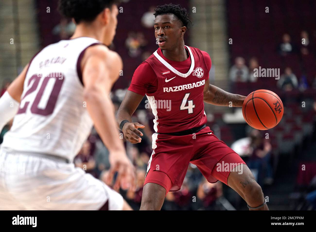 Arkansas guard Davonte Davis (4) looks to pass the ball against Texas A
