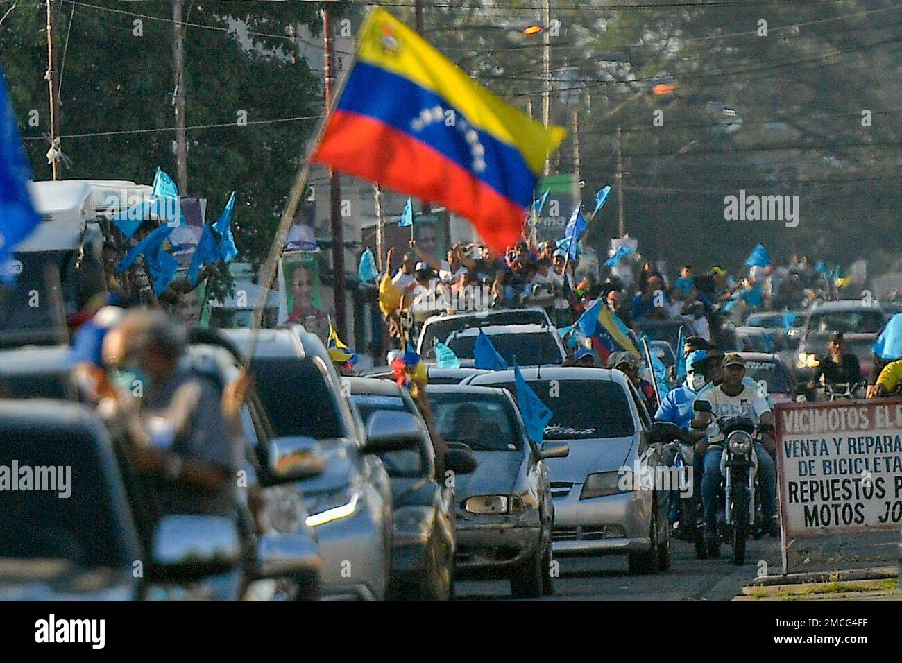 Supporters of opposition candidate for governor, Sergio Garrido, rally in  Barinas, Venezuela, Thursday, Jan. 6, 2022. The country's highest court  disqualified opposition candidate Freddy Superlano as he was leading the  count in