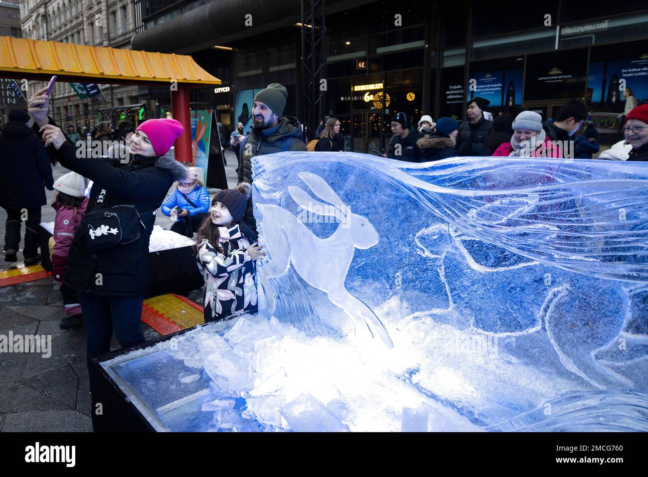 Helsinki, Finland. 21st Jan, 2023. People take a selfie with a rabbit-themed ice sculpture made in celebration of the Chinese New Year in Helsinki, Finland, Jan. 21, 2023. Credit: Matti Matikainen/Xinhua/Alamy Live News Stock Photo