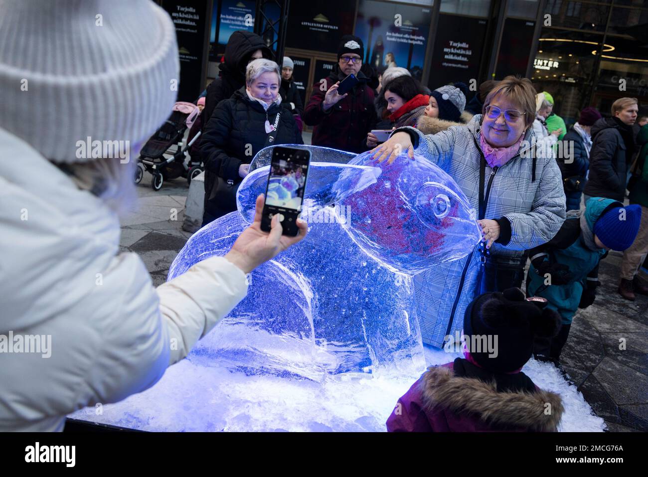 Helsinki, Finland. 21st Jan, 2023. A woman poses for photo with a rabbit-themed ice sculpture made in celebration of the Chinese New Year in Helsinki, Finland, Jan. 21, 2023. Credit: Matti Matikainen/Xinhua/Alamy Live News Stock Photo
