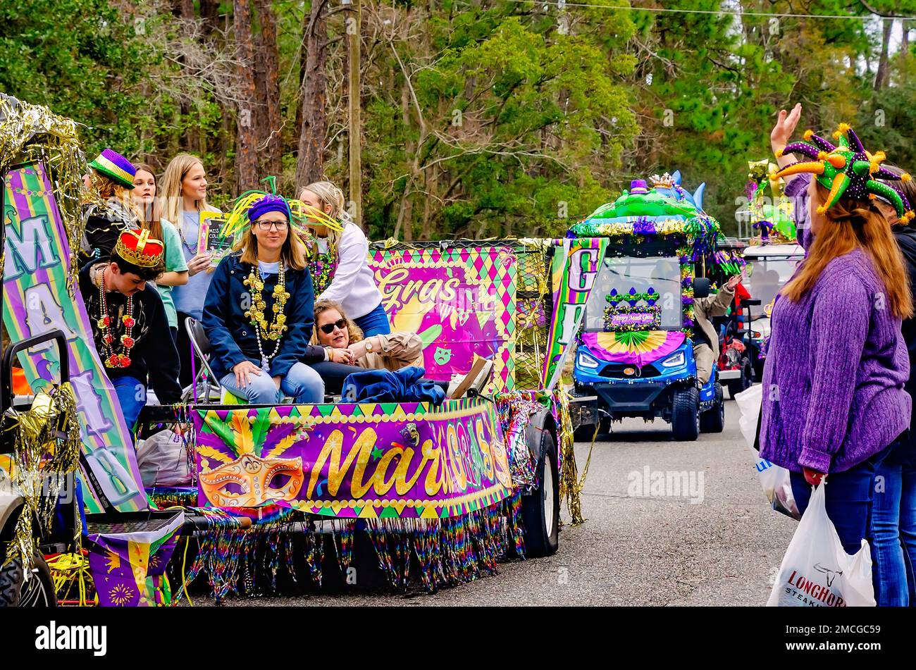 Members of Krewe de la Dauphine ride in the Krewe de la Dauphine Mardi Gras parade, Jan. 21, 2023, in Dauphin Island, Alabama. Stock Photo