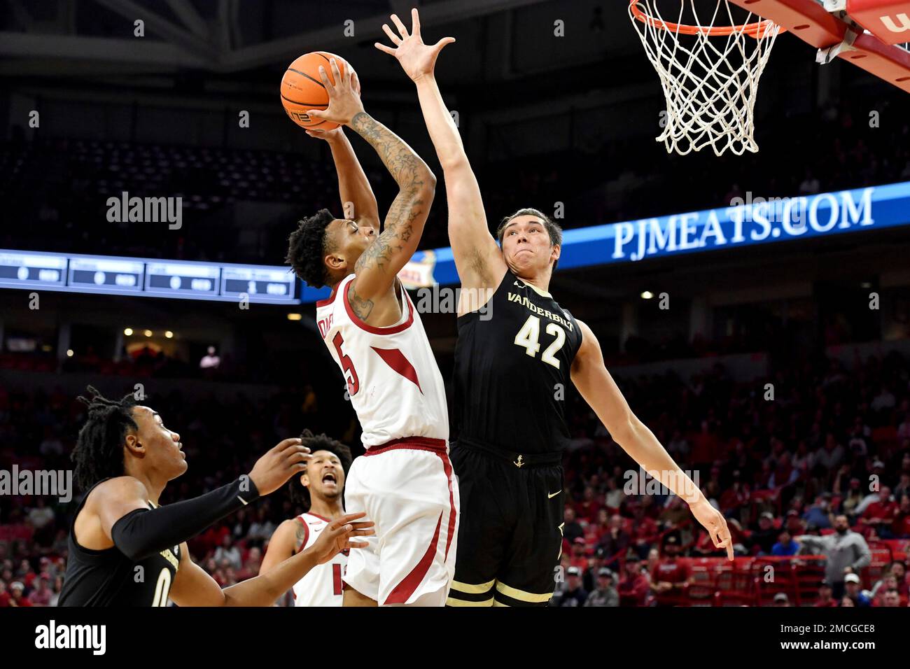 Arkansas guard Au'Diese Toney (5) is fouled by Vanderbilt forward