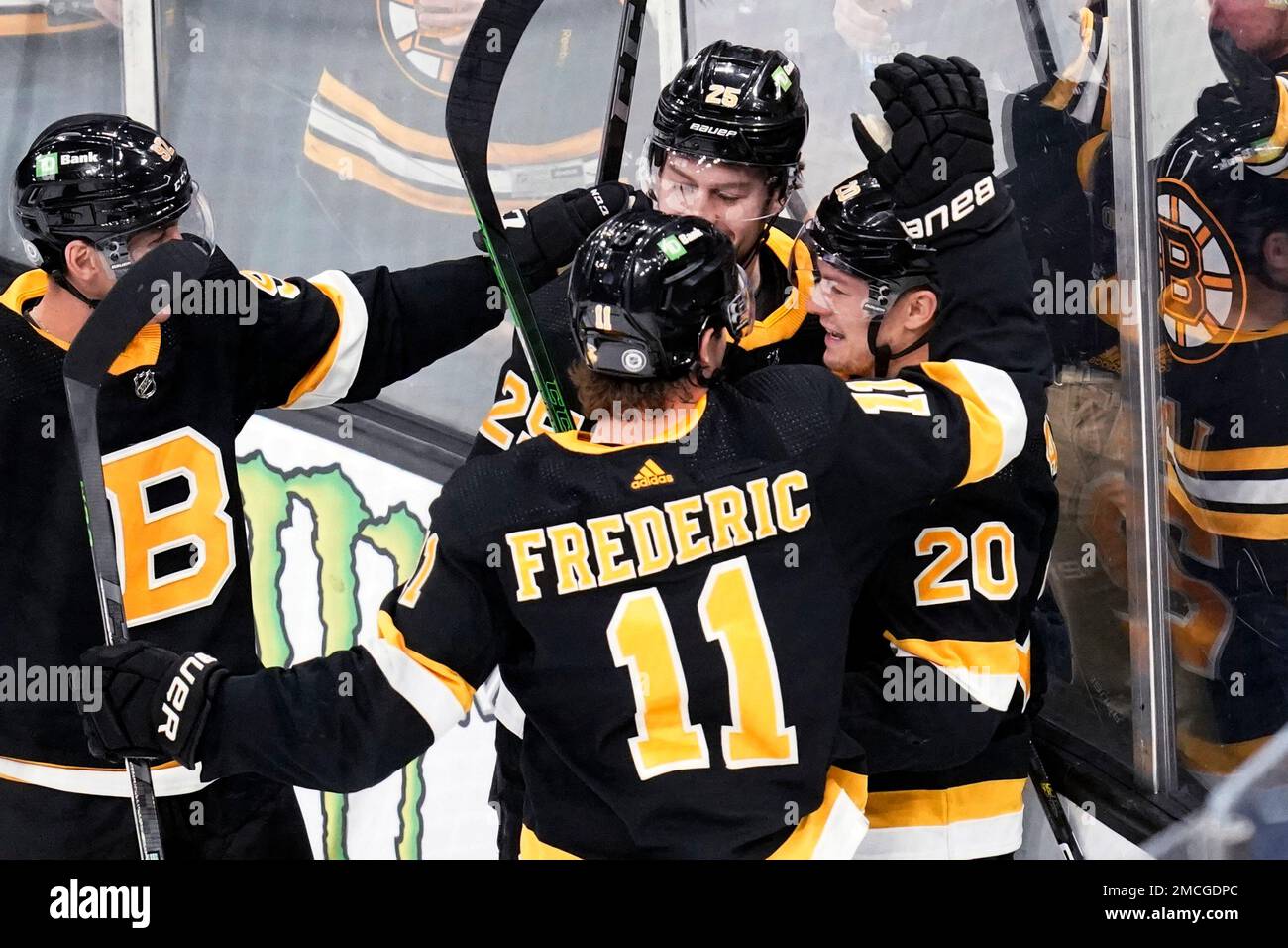 Boston Bruins center Curtis Lazar (20) is congratulated after his goal  during the first period of the team's NHL hockey game against the New Jersey  Devils, Tuesday, Jan. 4, 2022, in Boston. (