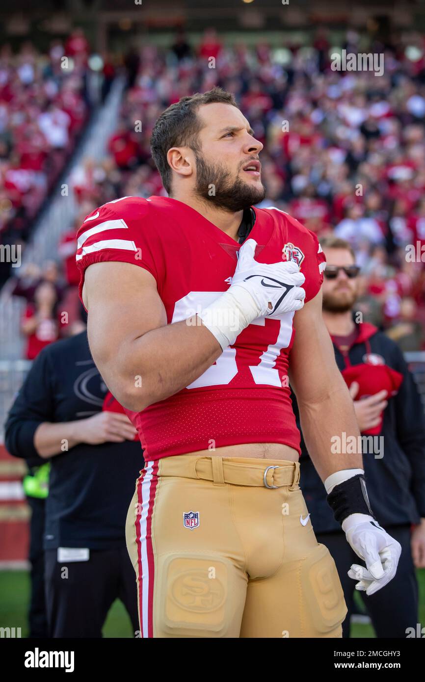 Defensive lineman (97) Nick Bosa of the San Francisco 49ers stands for the  National Anthem before playing against the Houston Texans in an NFL  football game, Sunday, Jan. 2, 2022, in Santa