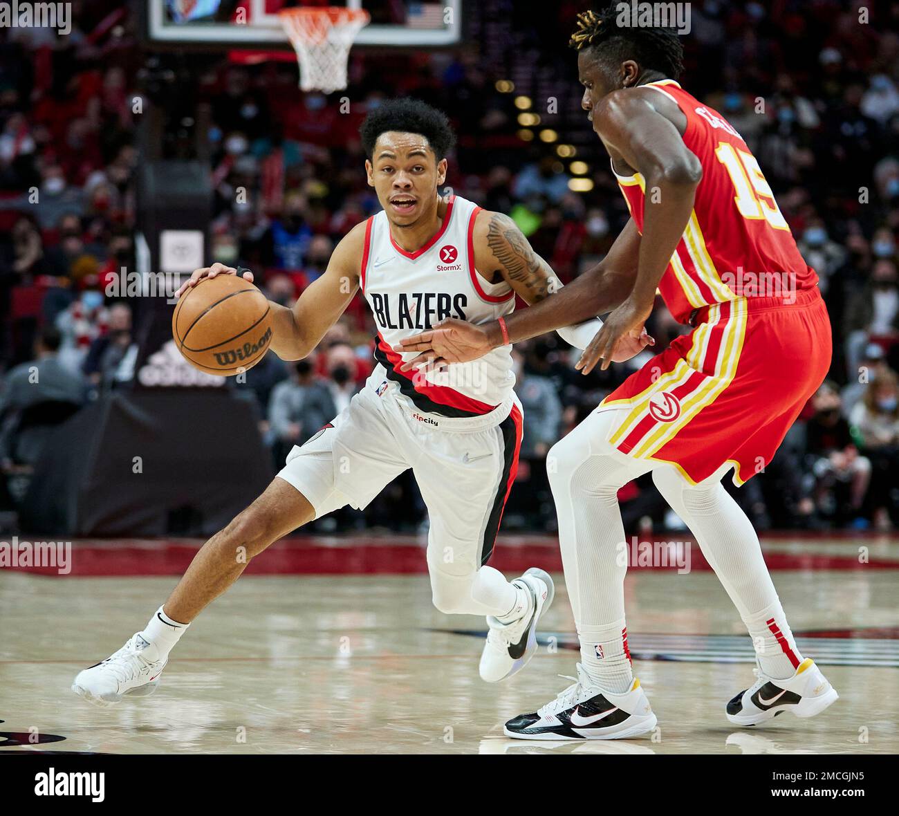 Portland Trail Blazers guard Anfernee Simons left dribbles