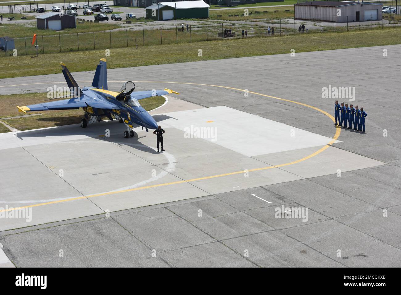 Uscga Ramp U.S. Navy and Marine Corps Blue Angels members stand at parade rest in ...
