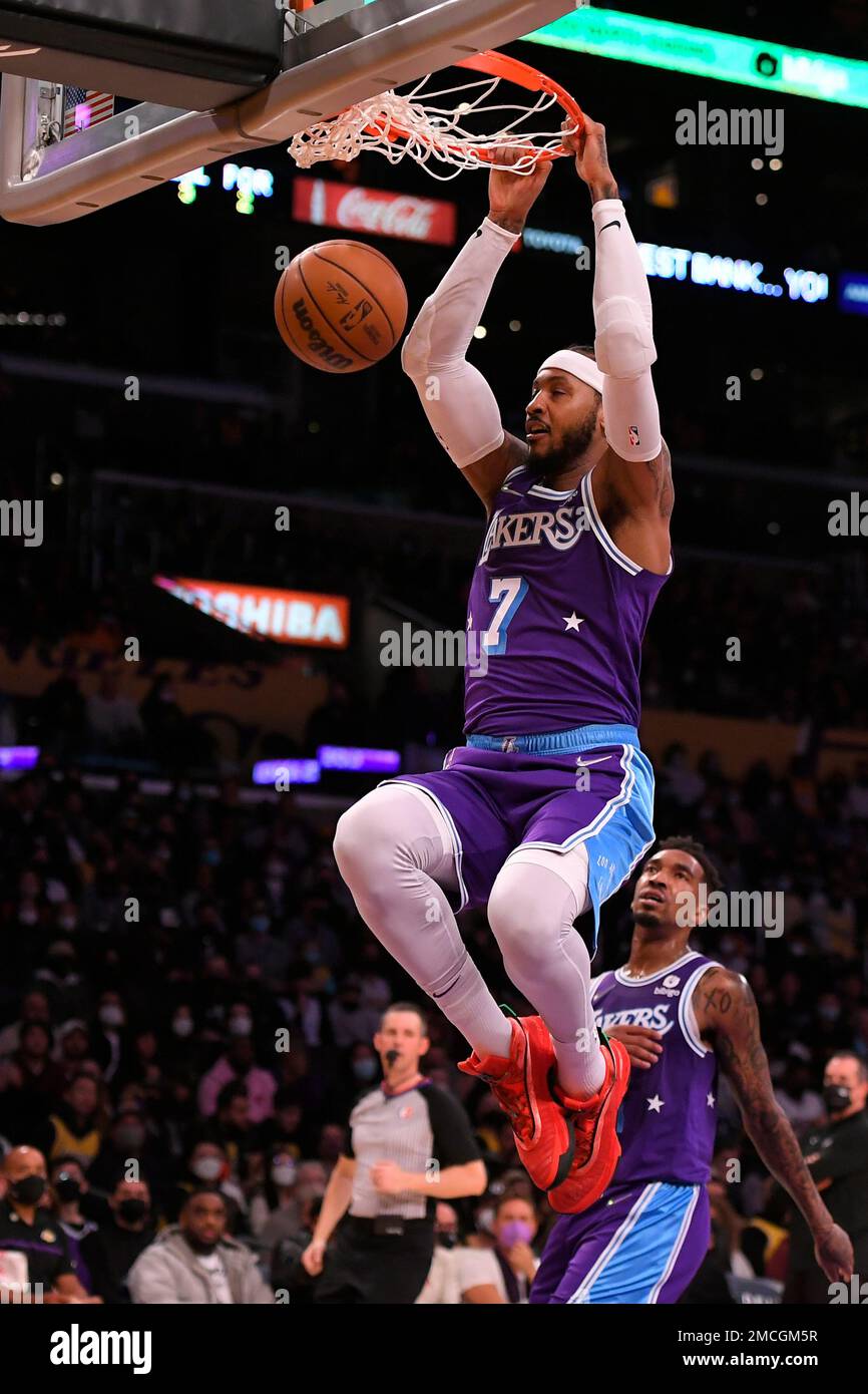 Los Angeles Lakers forward Carmelo Anthony (7) dunks the ball while playing  the Portland Trail Blazers in an NBA basketball game, Friday Dec. 31, 2021,  in Los Angeles. (AP Photo/John McCoy Stock, image size:866x1390