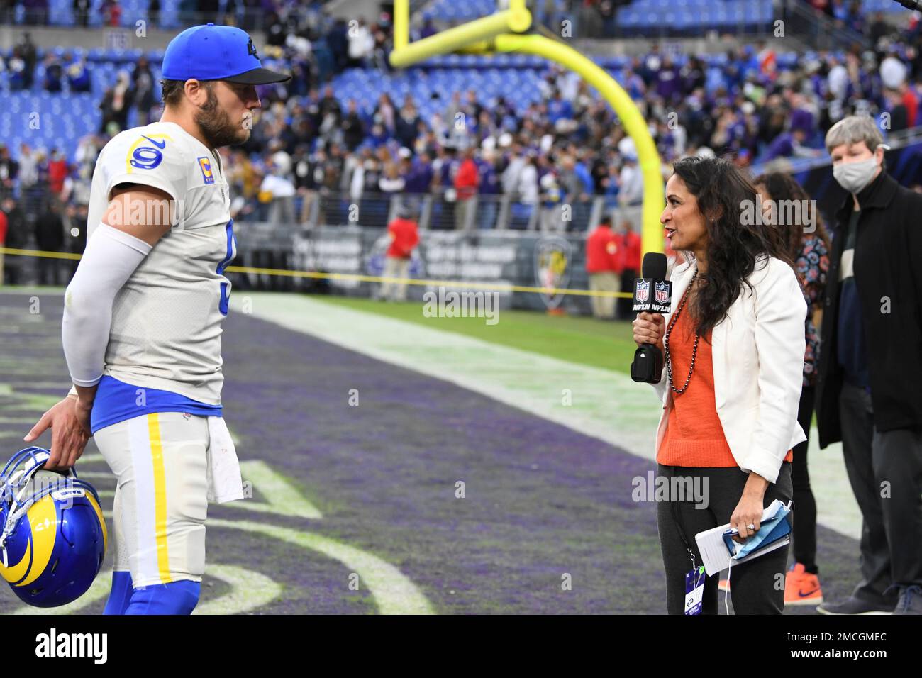 NFL Network sideline reporter Aditi Kinkhabwala, left, talks with Baltimore  Ravens offensive tackle Alejandro Villanueva during pre-game warm-ups  before an NFL football game against the Pittsburgh Steelers, Sunday, Jan.  9, 2022, in