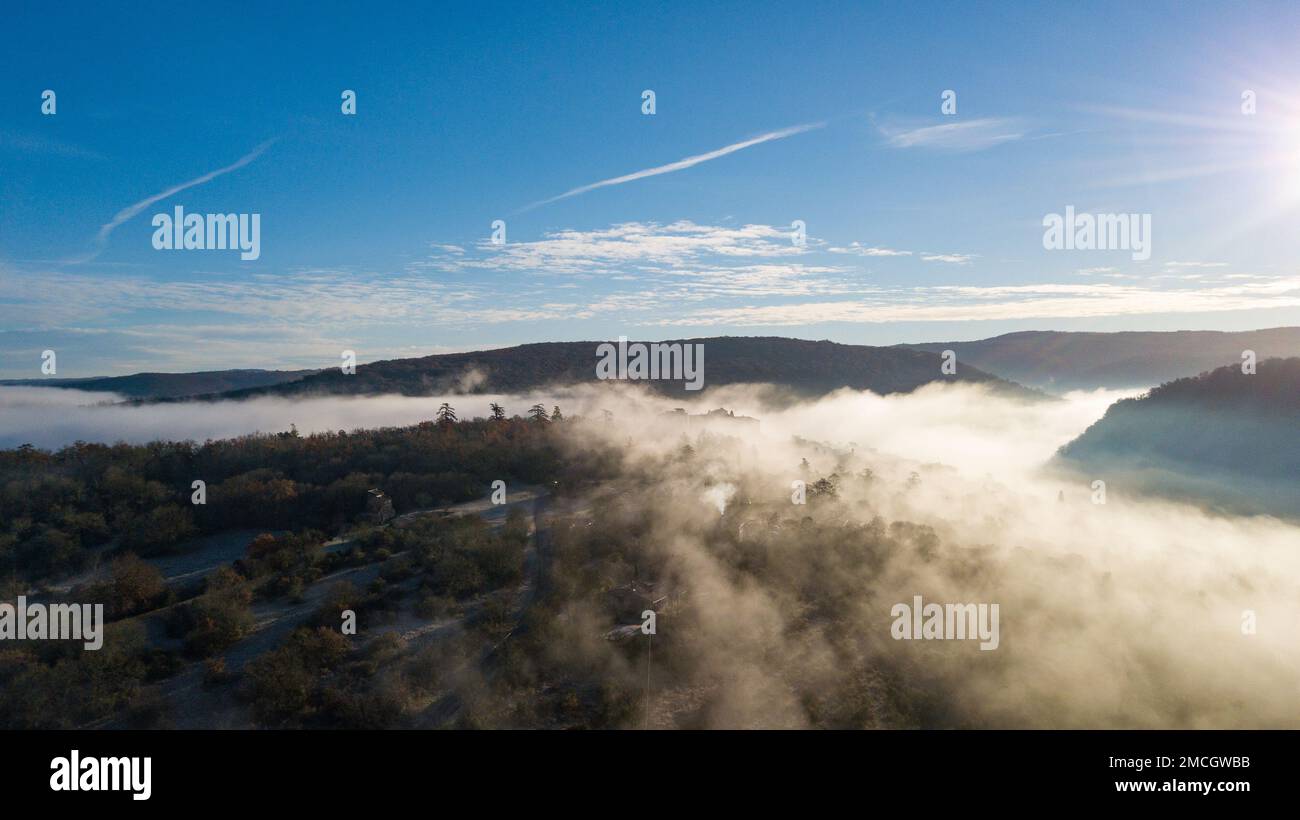 Beautiful view of Bruniquel castle hidden in the clouds, France Stock Photo
