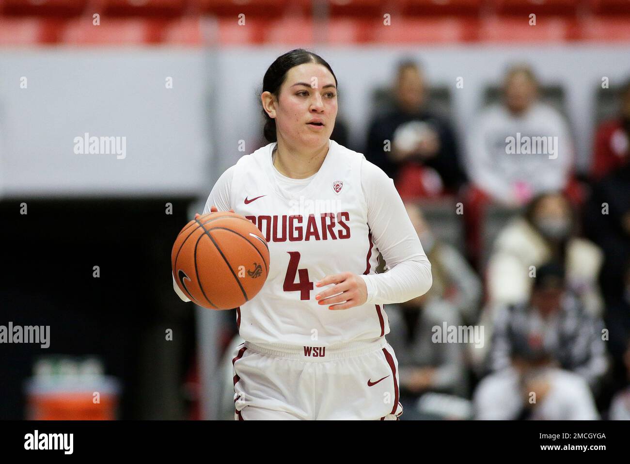 Washington State guard Krystal LegerWalker controls the ball during