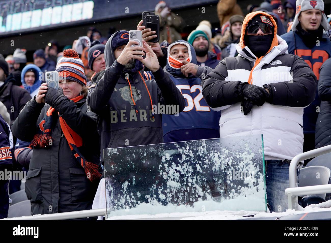Chicago Bears fans watch as the team enters the field before an NFL football game against the New York Giants Sunday, Jan. 2, 2022, in Chicago. (AP Photo/Charles Rex Arbogast) Stock Photo