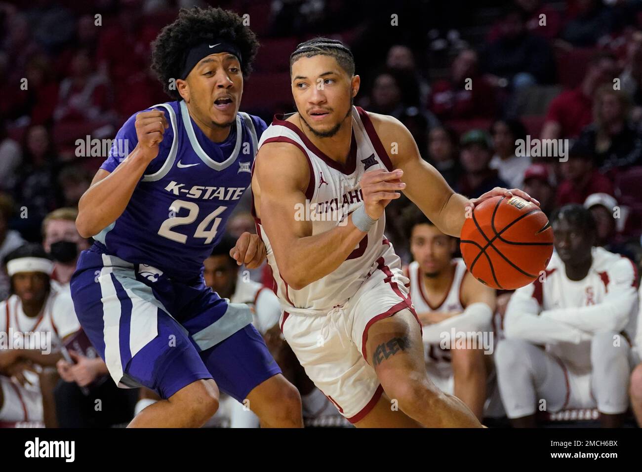 Oklahoma guard Jordan Goldwire, right, drives around Kansas State guard