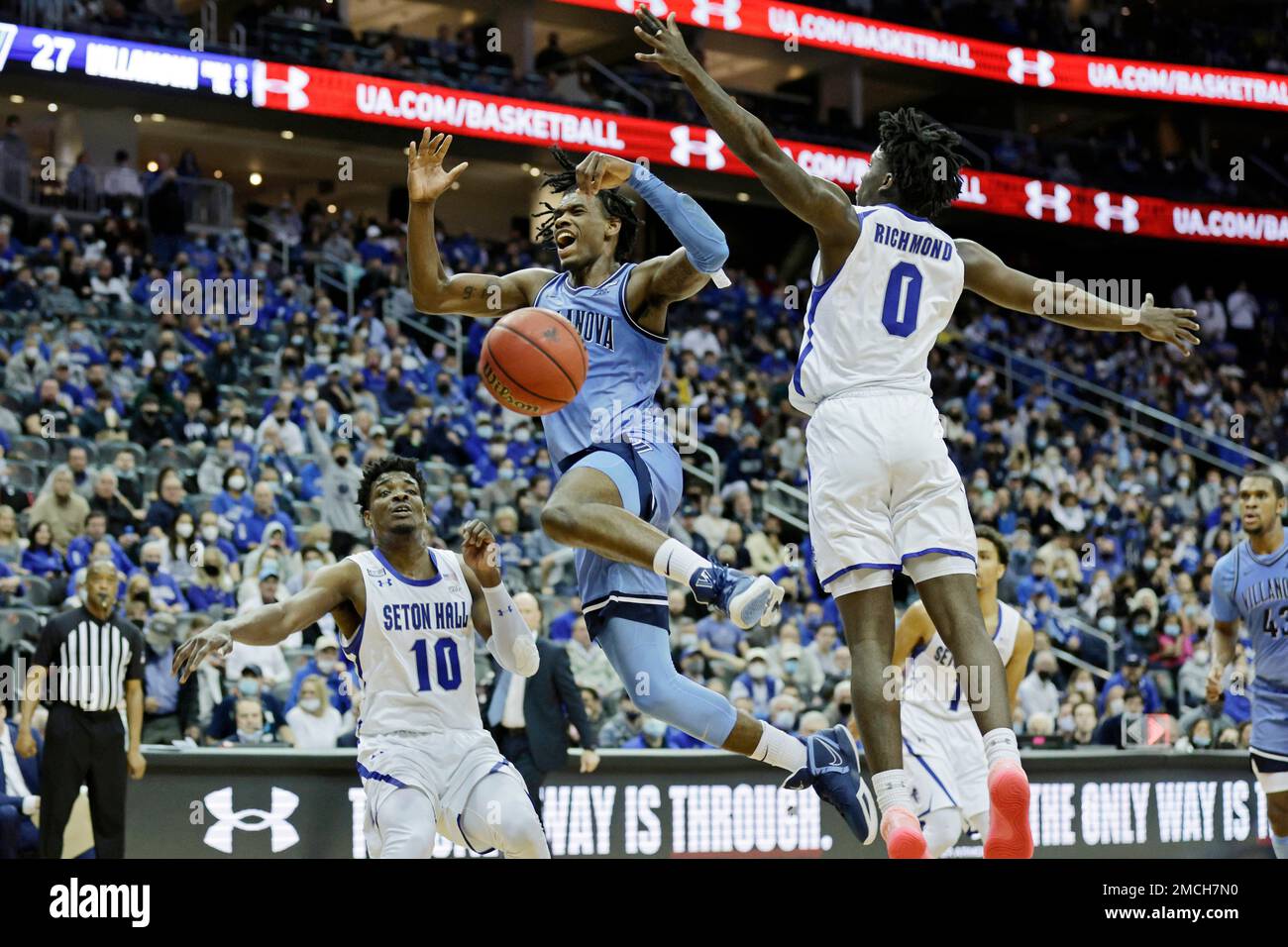 Villanova forward Brandon Slater reacts after being fouled driving to