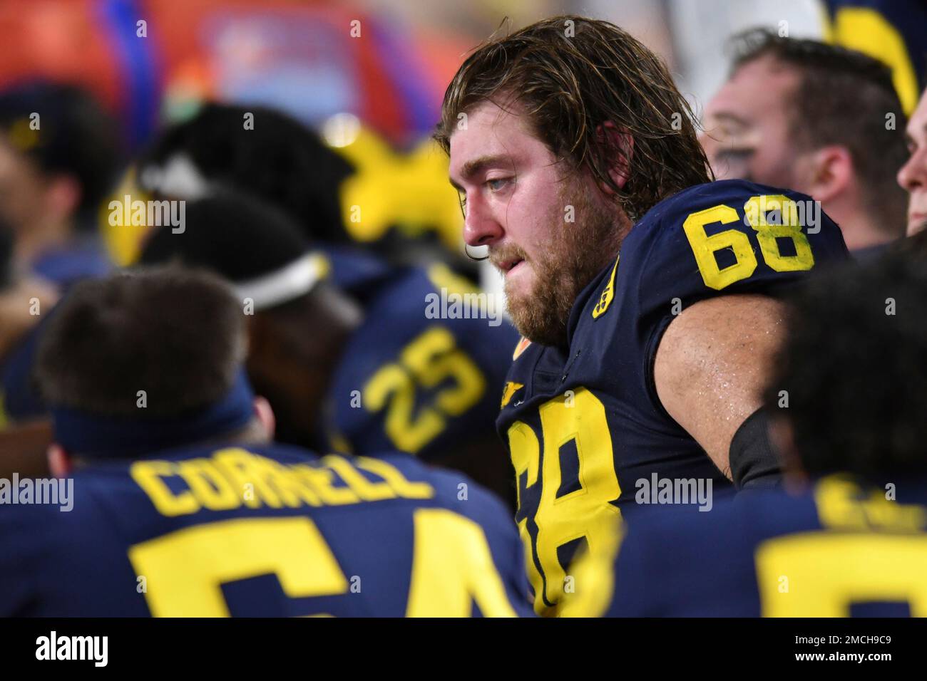 Michigan offensive lineman Andrew Vastardis reacts to their loss to