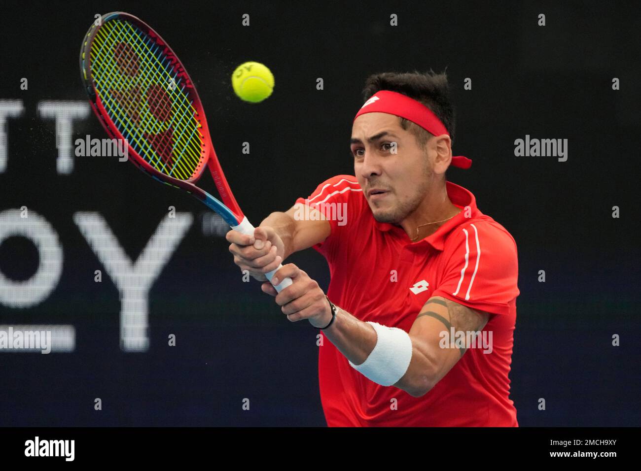 Chile's Alejandro Tabilo hits a backhand to Spain's Pablo Carreno Busta ...