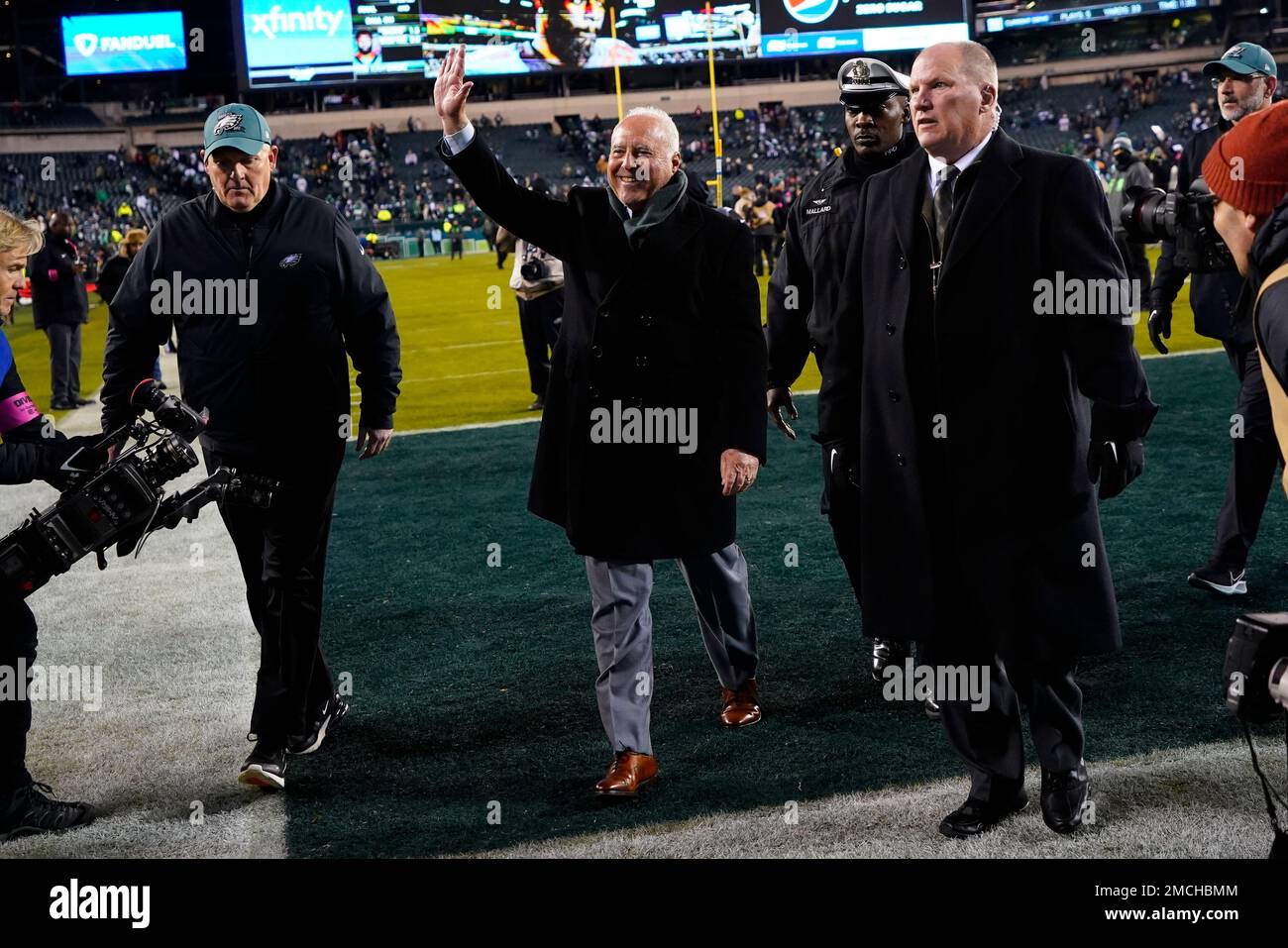 Philadelphia Eagles owner Jeffrey Lurie, center, gestures following an