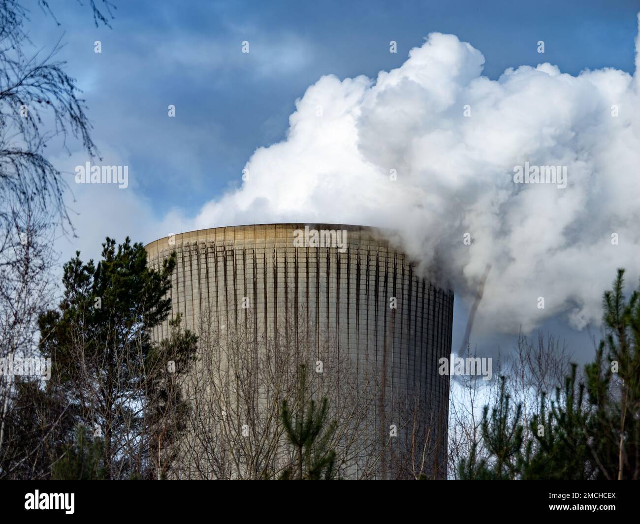 Smoke out of a cooling tower of a lignite power station. Burning fossil