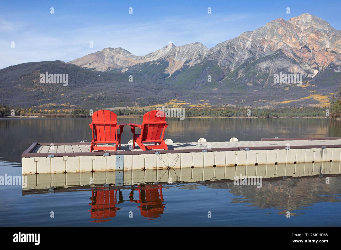 Red chairs on a dock in Pyramid Lake with a scenic view overlooking