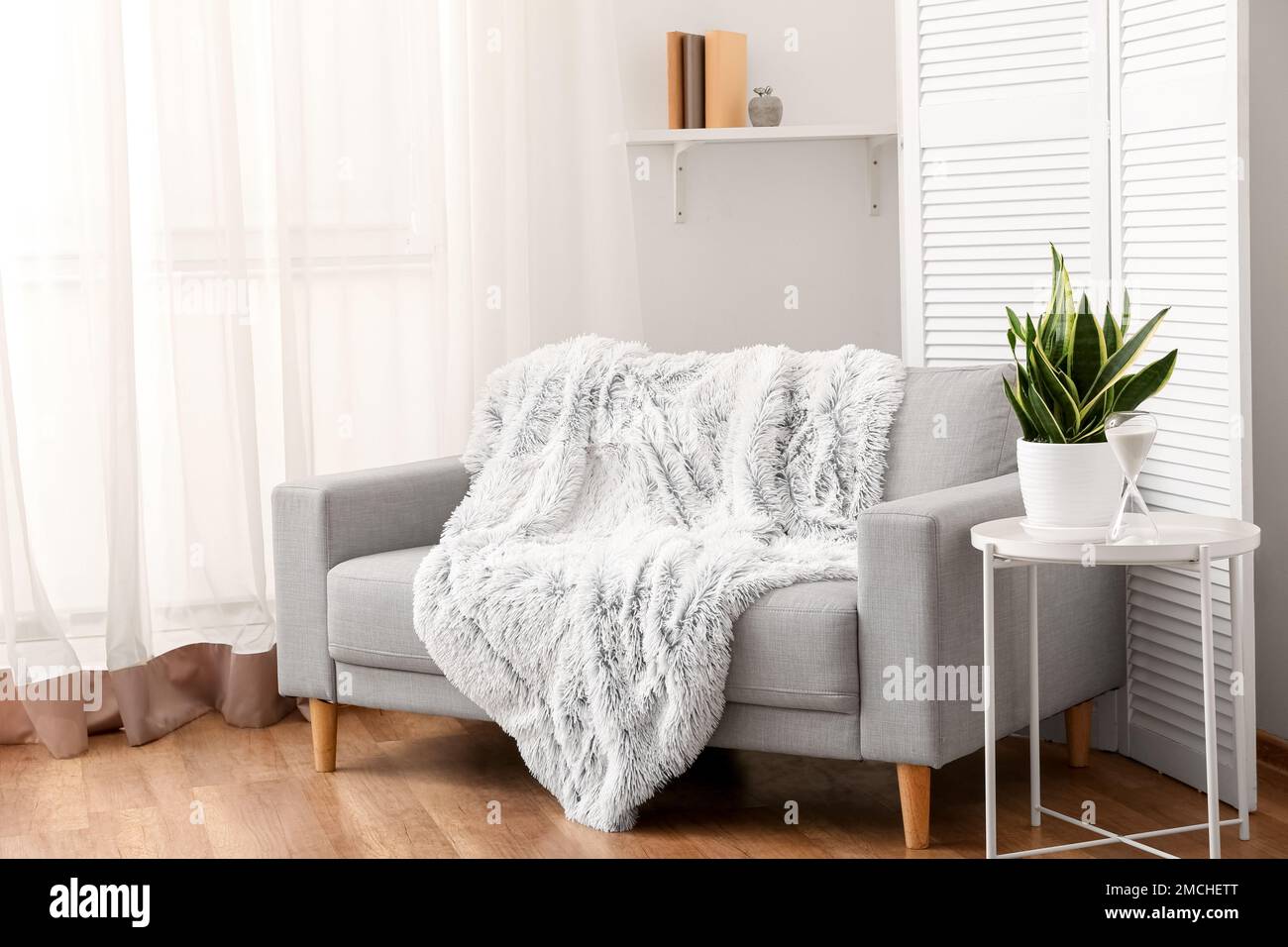 Interior of cozy living room with grey sofa and table Stock Photo Alamy