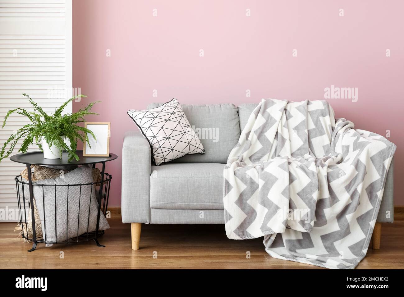 Interior of stylish living room with grey sofa and table Stock Photo ...