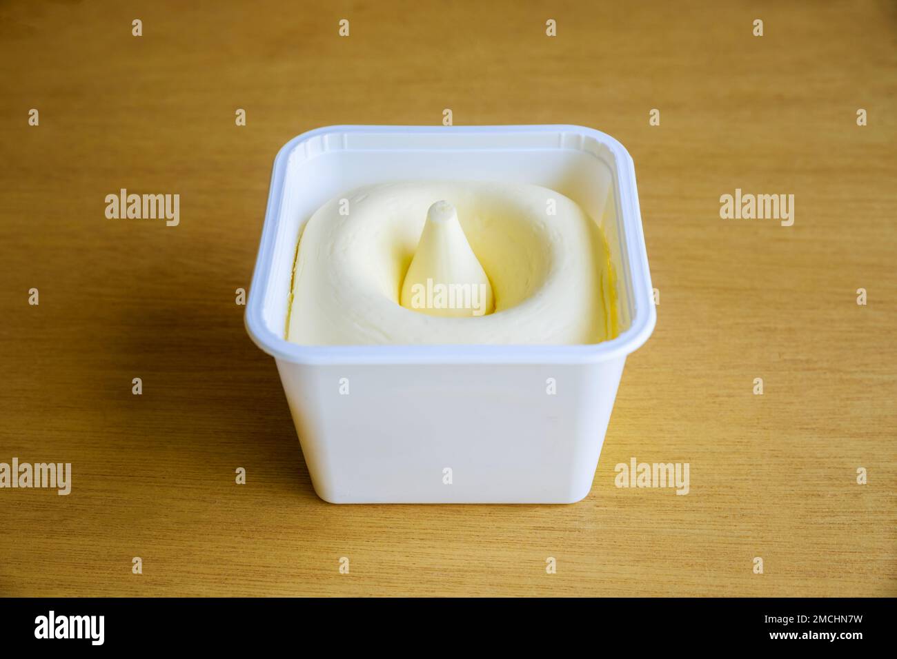 Plastic container contains whipped creamy butter Stock Photo Alamy