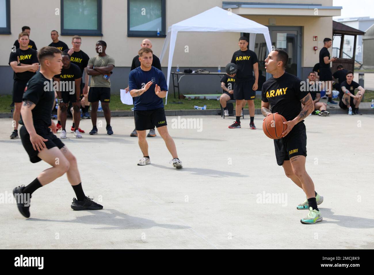 U.S. Army Cpl. Carlos Vázquez, an automated logistical specialist assigned to 1st Battalion, 68th Armor Regiment, 3rd Armored Brigade Combat Team, 4th Infantry Division, plays  basketball during an organizational day to celebrate Independence Day at Drawsko Pomorskie, Poland, July 4, 2022. The 3/4 ABCT is among other units assigned to the 1st Infantry Division, proudly working alongside NATO allies and regional security partners to provide combat-credible forces to V Corps, America's forward-deployed corps in Europe. Stock Photo