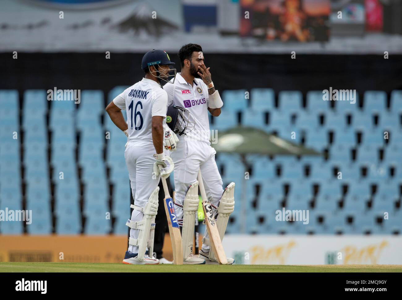 Indias Mayank Agarwal, left, with teammate KL Rahul watch the electronic screen as the TV umpire reviews an LBW appeal by South Africa during the Test Cricket match between South Africa India