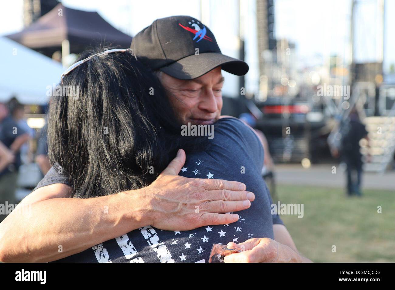 Actor and humanitarian Gary Sinise hugs a Gold Star Family member July