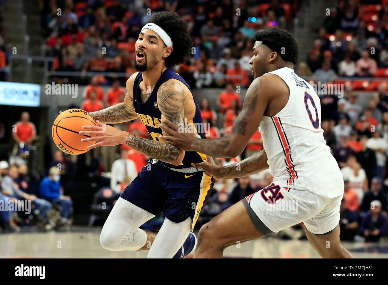 Murray State guard Tevin Brown (10) drives to the basket around Auburn