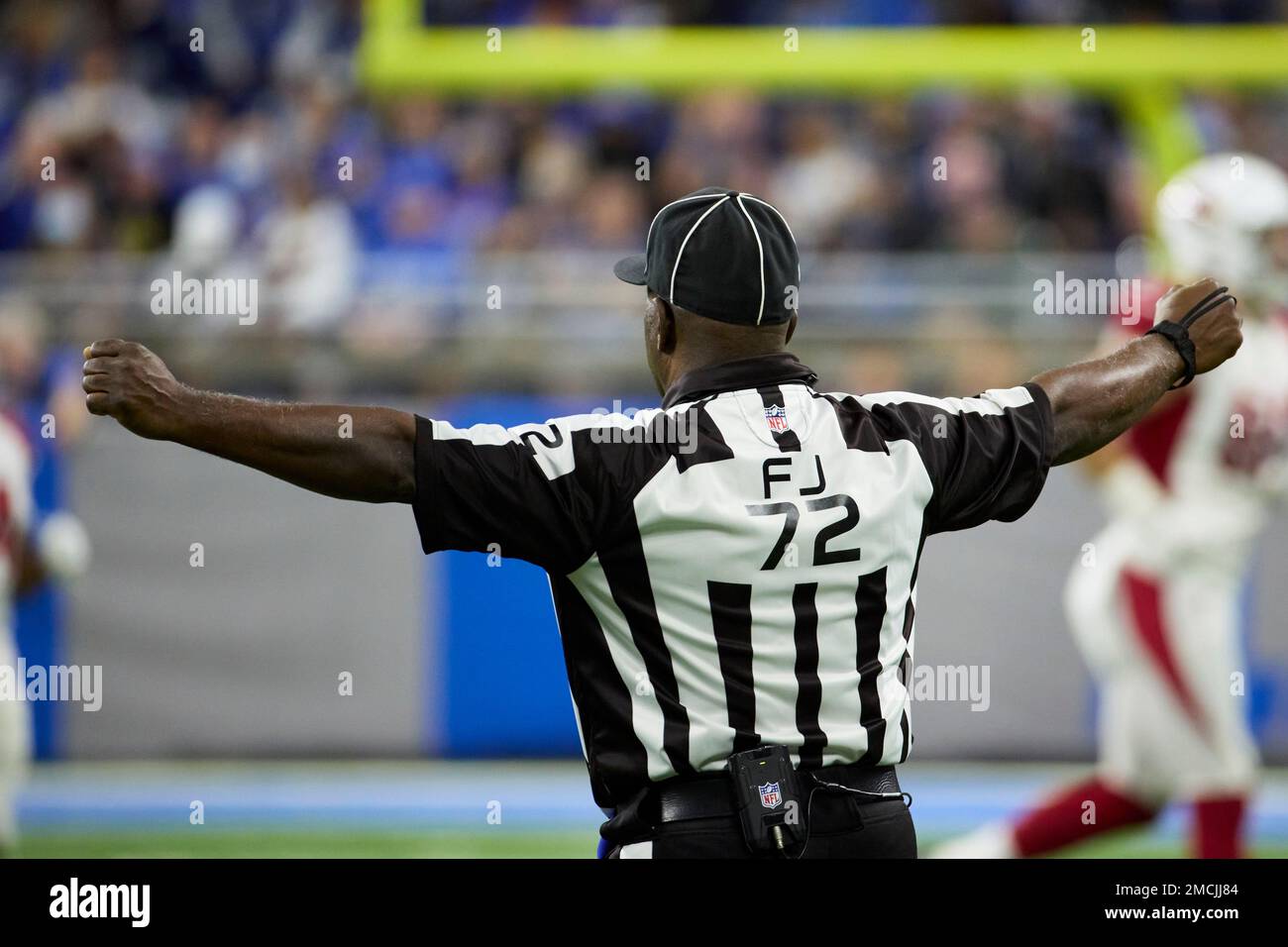 Field judge Michael Banks (72) wears a Salute To Service emblem on