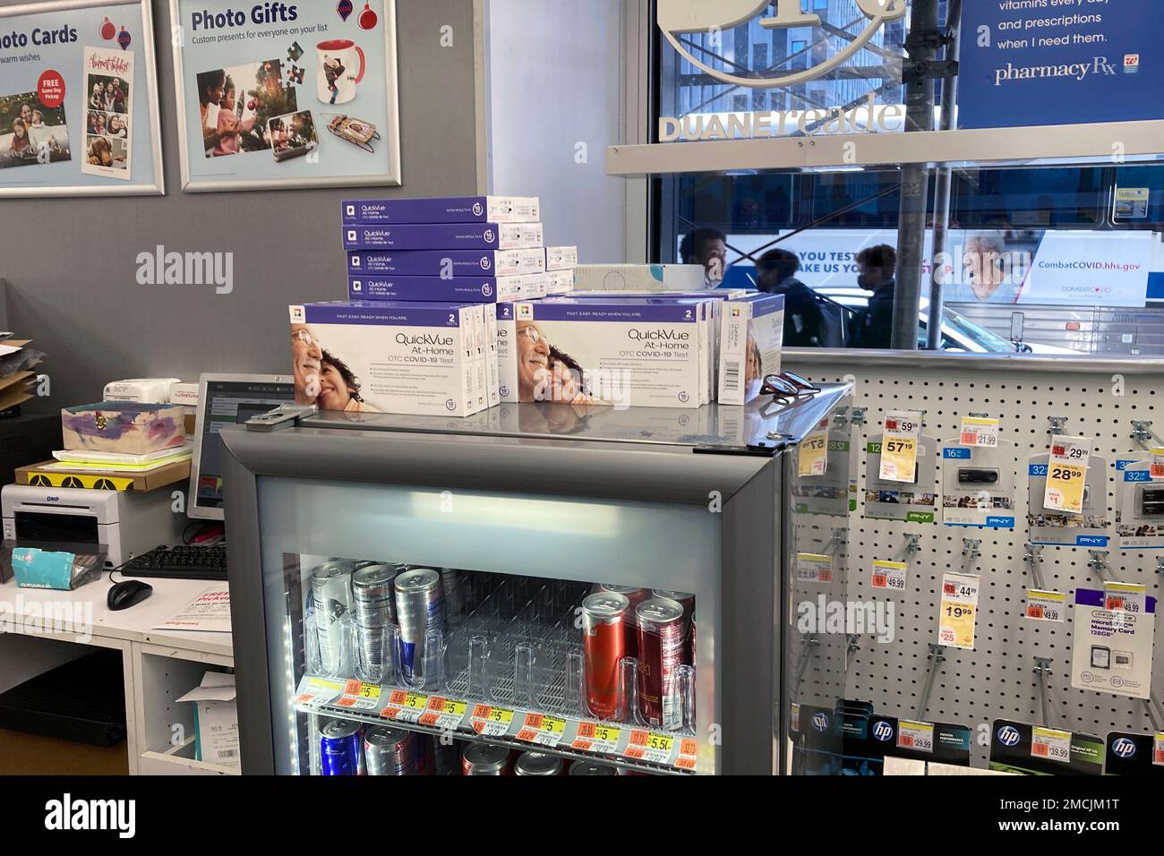 Athome COVID19 test kits are for sale from behind the cash register