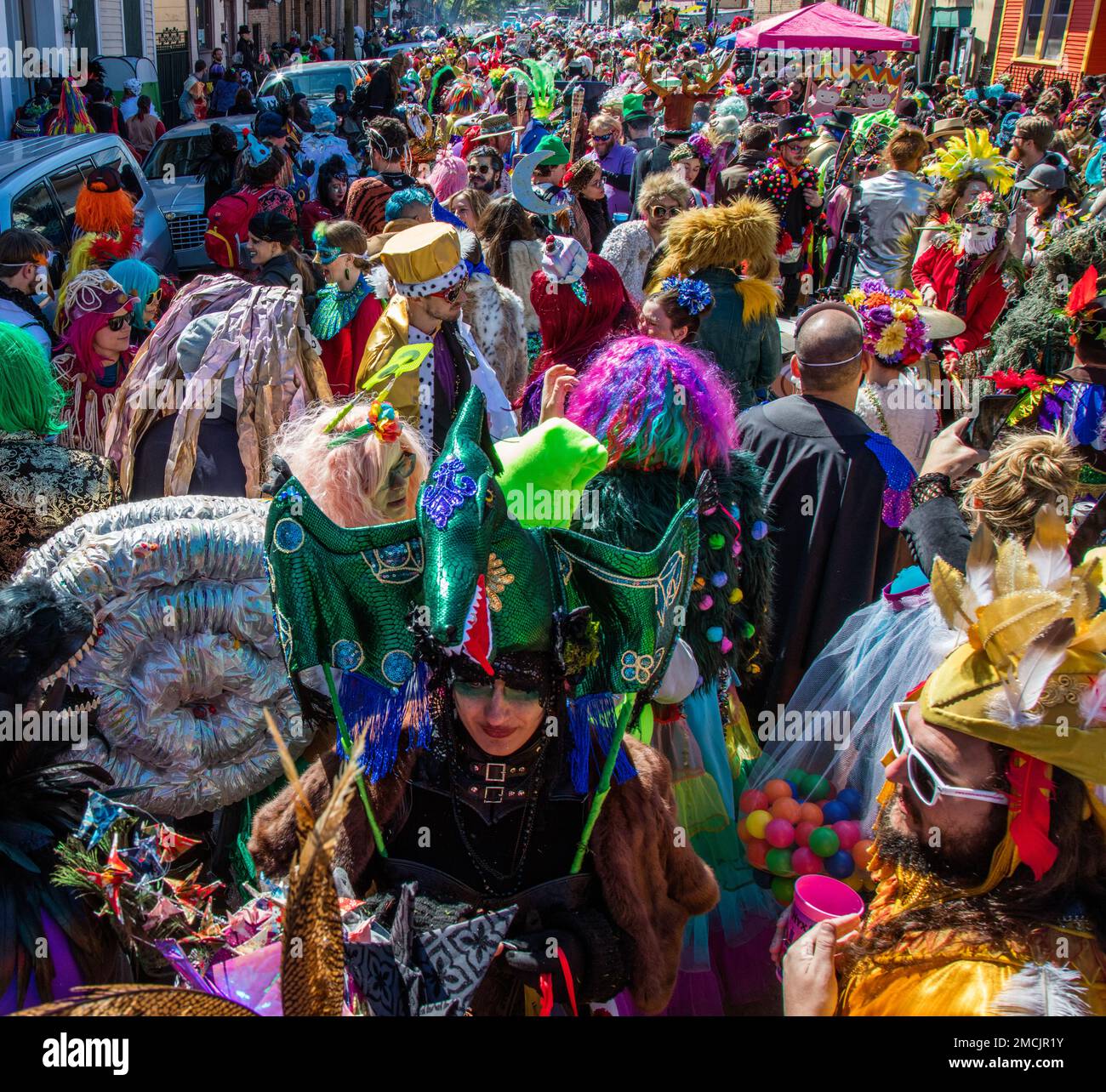 Crowded streets during walking parade (Krewe of Saint Anne) during