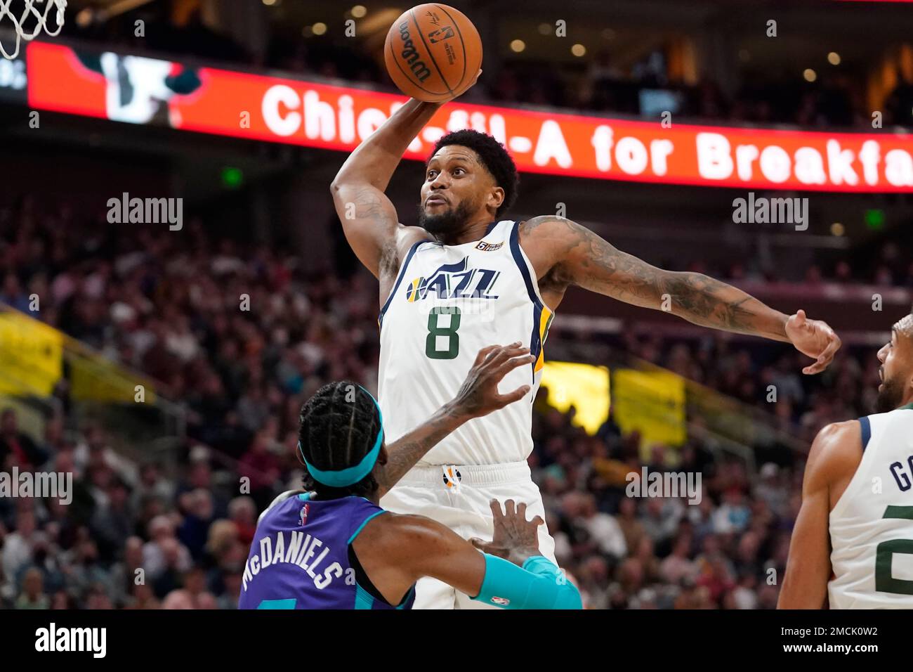 Utah Jazz forward Rudy Gay (8) goes to the basket as Charlotte Hornets  forward Jalen McDaniels defends in the second half during an NBA basketball  game Monday, Dec. 20, 2021, in Salt